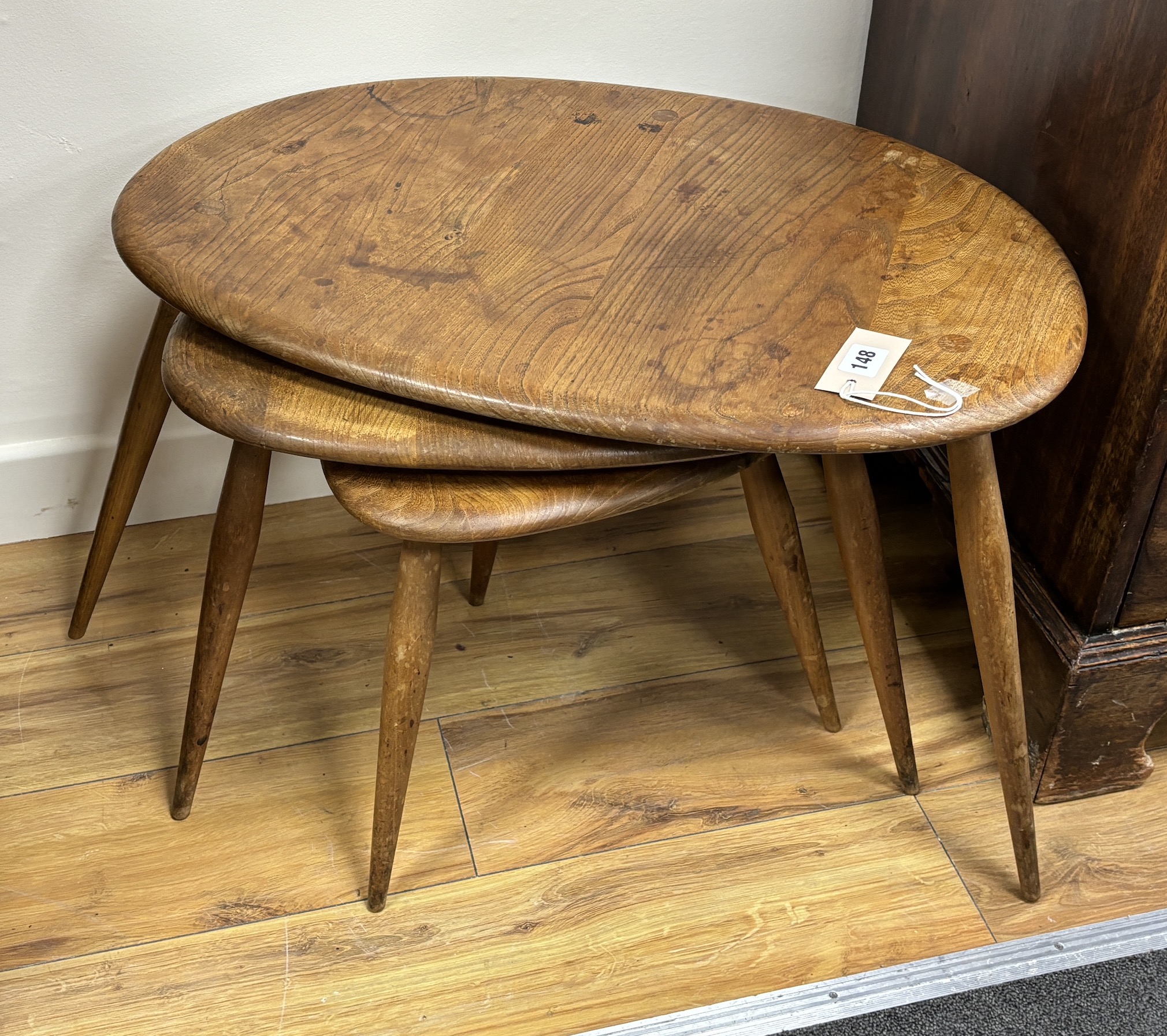 A nest of three Ercol light elm tea tables, width 65cm, depth 43cm, height 38cm